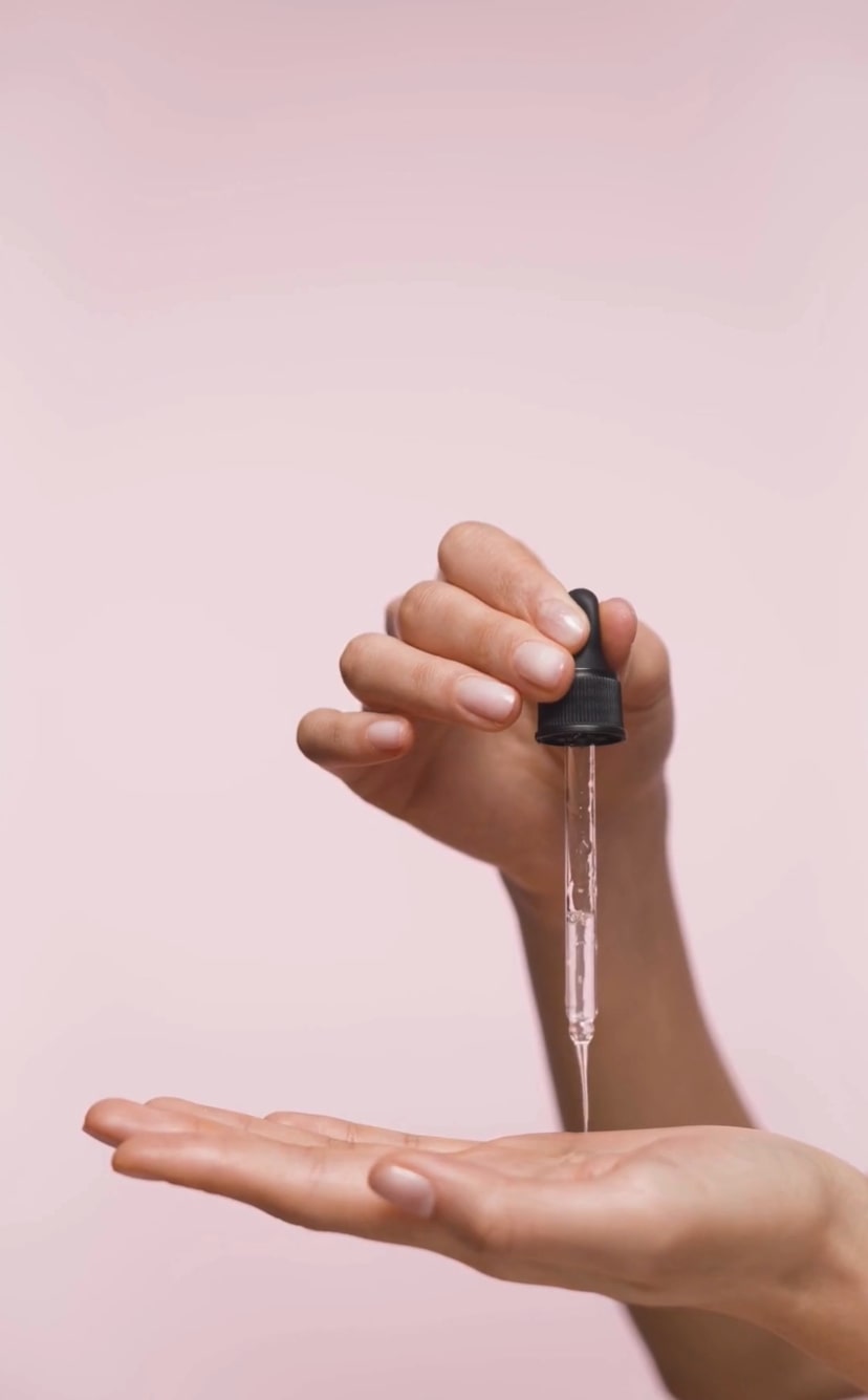 Pouring pherve serum in hand palm